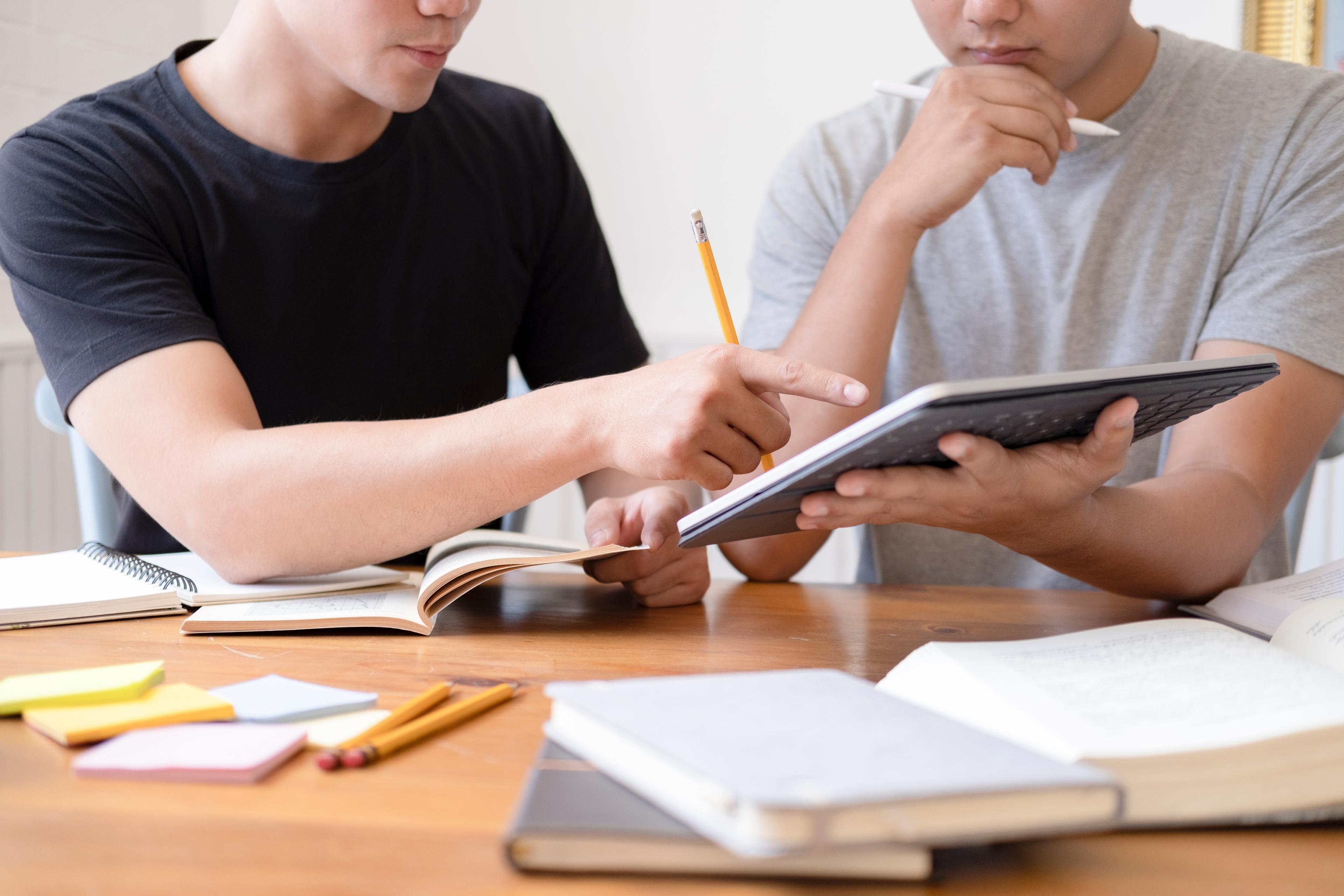 Confident students benefiting from effective Digital SAT preparation, smiling outdoors as they achieve their test goals.